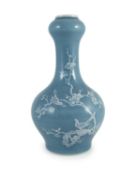 A Chinese claire de lune glazed white slip decorated vase - 25cm highdecorated with birds amid