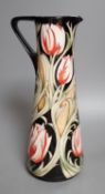 A Moorcroft 'race against time' jug by Paul Hilditch, limited edition 11/40, boxed,31 cms high.