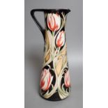 A Moorcroft 'race against time' jug by Paul Hilditch, limited edition 11/40, boxed,31 cms high.