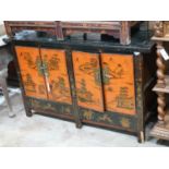 A Chinese lacquered low cabinet, width 112cm depth 41cm height 75cm