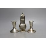 A modern pair of sterling mounted dwarf candlesticks, 92mm and a George V silver sugar caster, 16.