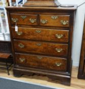 Am 18th century oak chest of two short and three long drawers fitted with brass handles, width