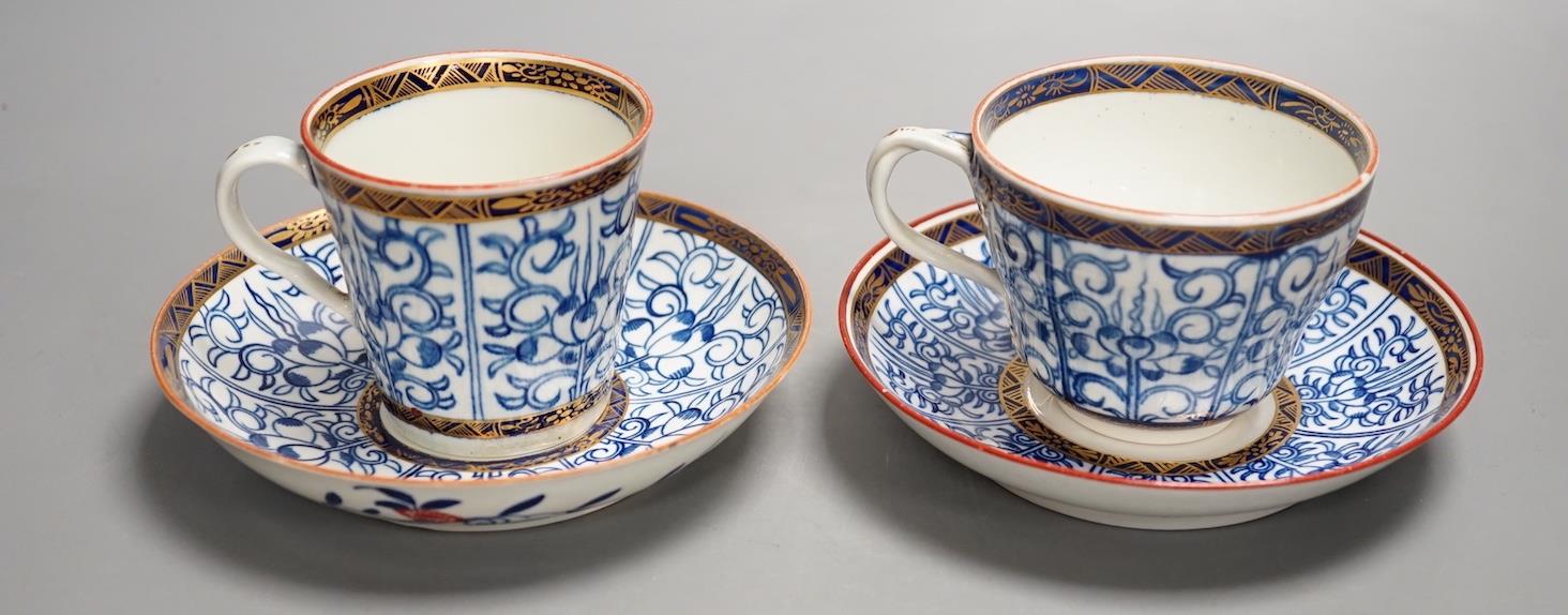 A Worcester coffee cup and saucer of rare Sevres shape with entwined handle painted with the Royal