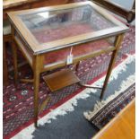 An Edwardian satinwood banded mahogany bijouterie table with under tier, width 65cm, depth 44cm,