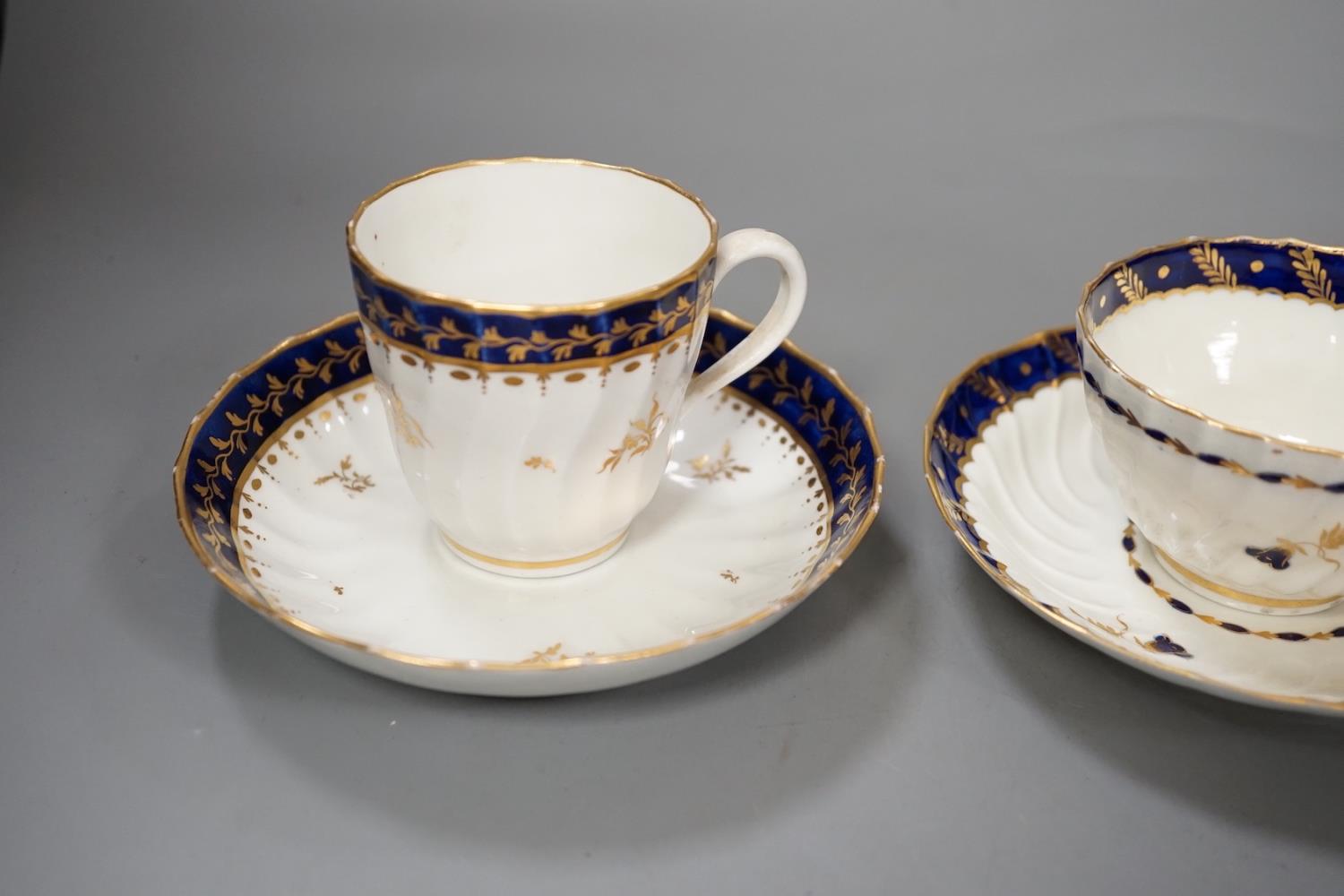 Three flight Worcester shankered teawares two coffee cup and saucers with blue borders and a teabowl - Image 2 of 14