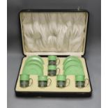 Boxed set of six Shelley 8775/4 green coffee cans and saucers in silver handle mounts