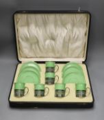 Boxed set of six Shelley 8775/4 green coffee cans and saucers in silver handle mounts