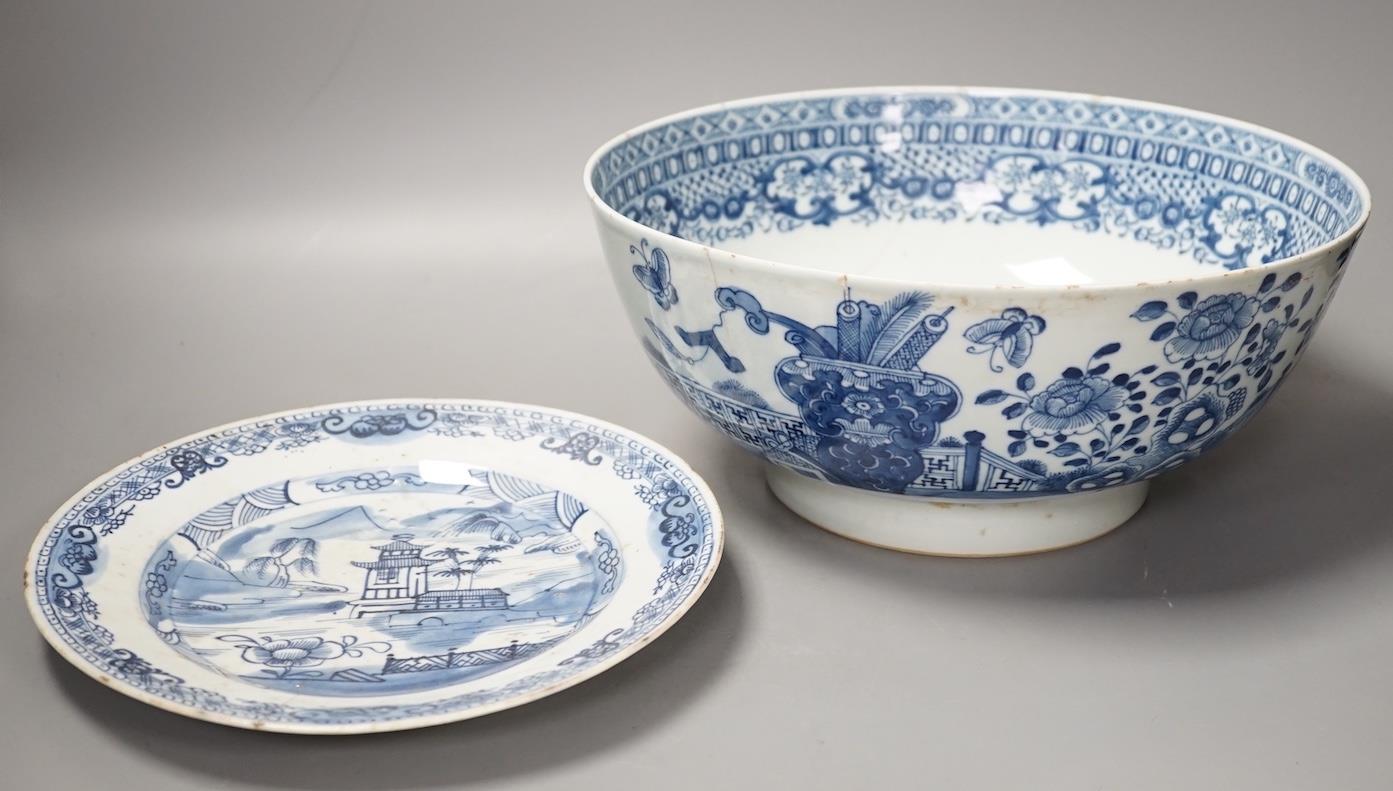 An 18th century Chinese blue and white punch bowl and similar plate. Largest 29cm