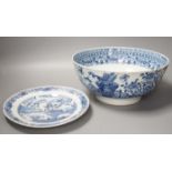 An 18th century Chinese blue and white punch bowl and similar plate. Largest 29cm