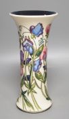 A Moorcroft 'sweetness' vase, boxed,25 cms high.