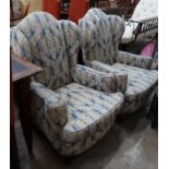 A pair of 1920's upholstered wing armchairs, width 74cm depth 70cm height 106cm