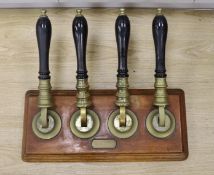 A brass and oak four tap counter beer dispenser - 64cm long