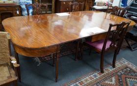 A George III mahogany D end extending dining table and six reproduction Chippendale style mahogany