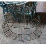 A pair of painted metal three tier corner garden pot stands, height 75cm