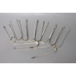 Ten assorted late 18th/early 19th century pairs of silver sugar tongs, various patterns, dates and