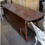 An 18th century style oak gateleg wake dining table, length 190cm extended 150cm height 79cm