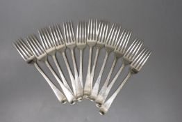 A set of twelve late George III silver Old English feather edge pattern table forks, indistinct