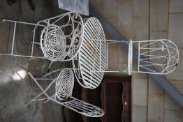 A circular metal garden table and three folding chairs, table diameter 90cm height 76cm