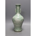 A Chinese slip decorated celadon ground arrow vase 28cm