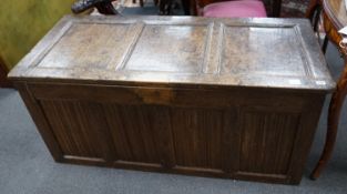 A 17th / 18th century panelled oak coffer, width 140cm depth 61cm height 62cm