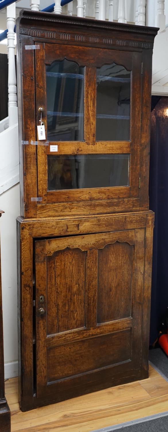An 18th century two-sectional Provincial oak standing corner cupboard, width 80cm depth 30cm