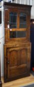 An 18th century two-sectional Provincial oak standing corner cupboard, width 80cm depth 30cm