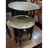 Two Indian brass tray top folding tables, largest width 56cm height 49cm