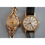 A lady's 9ct gold Accurist manual wind wrist watch, on a 9ct gold bracelet, gross weight 13 grams