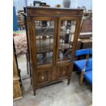 An Edwardian marquetry inlaid mahogany display cabinet, width 94cm, depth 38cm, height 174cm