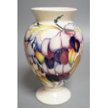 A Moorcroft 'purple wisteria' vase, 2013,17.5 cms high.