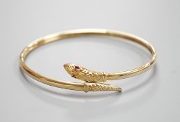 A modern 375 and gem set serpent bangle, 11.3 grams.