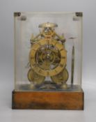 A 19th century brass twin fusee skeleton clock in perspex case with key and pendulum