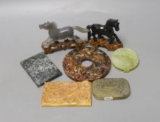 A group of Chinese hardstone plaques, two horse figures, a bi disc and a belt plaque (7)