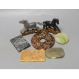 A group of Chinese hardstone plaques, two horse figures, a bi disc and a belt plaque (7)