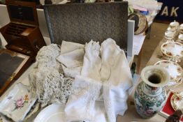 A collection late 19th early 20th century continental linen table cloths, table centres etc, some