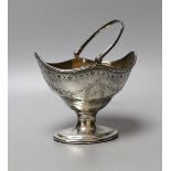 A George III silver oval sugar basket, maker C.S, London, 1787, width 12.1cm, 156 grams.