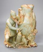 A late 19th century soapstone figural vase. 18cm