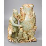 A late 19th century soapstone figural vase. 18cm