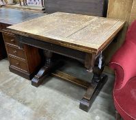 A 1930's oak draw leaf dining table, length 92cm, width 84cm, height 76cm