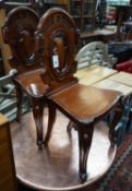 A pair of Victorian mahogay hall chairs