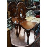 A pair of Victorian mahogay hall chairs