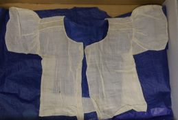 An 18th century, rare fine linen, Broiderie Anglaise andHollie point lace worked baby’s vest. The
