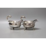 A pair of George II silver sauceboats, with flying scroll handles, maker's mark rubbed, London,