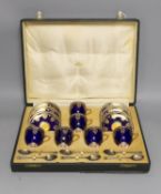 Boxed Royal Worcester blue coffee set with gilt stylised shell and swag design together with six