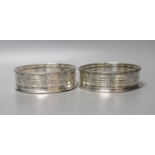 A pair of 19th century pierced silver wine coasters, marks rubbed, diameter 12.1cm (a.f.).