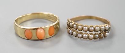 A late Victorian 15ct gold and three stone split coral set ring, size O, gross 3.3 grams and a