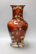 A large black Ryden pottery red glazed vase 47cm