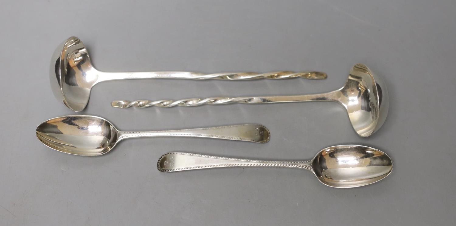 A pair of George III Scottish silver sauce ladles, with spiral handles, Alexander Spence, Edinburgh,