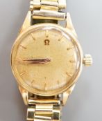 A lady's 18ct gold Omega manual wind wrist watch, on associated gilt bracelet, case diameter 23mm,