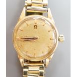 A lady's 18ct gold Omega manual wind wrist watch, on associated gilt bracelet, case diameter 23mm,
